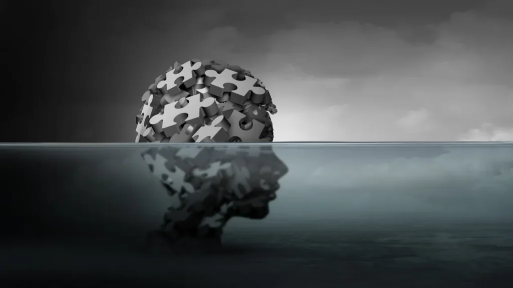 Head made from jigsaw pieces, half submerged in water - MAOA Gene